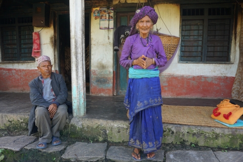 Fig 2. An 82-year-old Brahmin woman stands in front of her house explaining that her three sons (1 married with 3 children, 2 with a disability) live under the same roof but have separate kitchens.